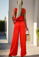 Ærmeløs Serena jumpsuit med vide ben og åben ryg