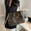 Opal - Leopardprint håndtaske med struktureret design
