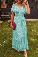 Ruth - Stilfuld plisseret V-hals kjole med blomsterprint